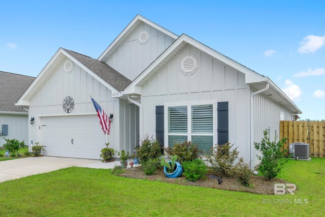 4175 Montague Dr, Gulf Shores, AL 36542 - view of front of property with board and batten siding, a garage, roof with shingles, and concrete driveway