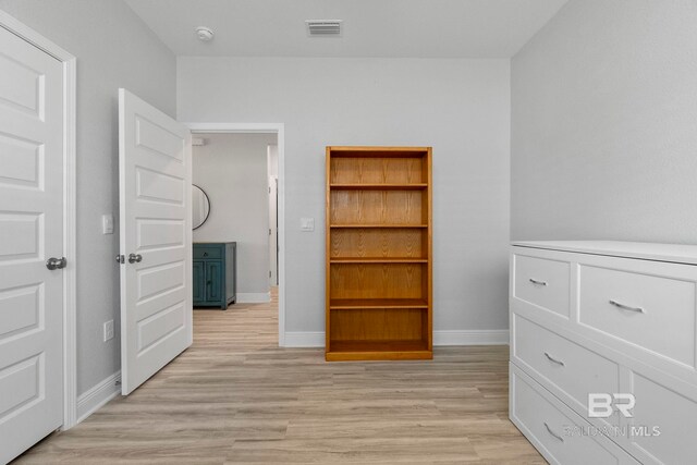 4175 Montague Dr, Gulf Shores, AL 36542 - unfurnished bedroom featuring light wood-type flooring and baseboards