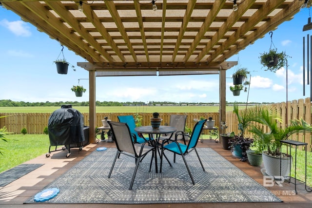 4175 Montague Dr, Gulf Shores, AL 36542 - view of patio featuring a pergola, outdoor dining space, a wooden deck, a grill, and a rural view
