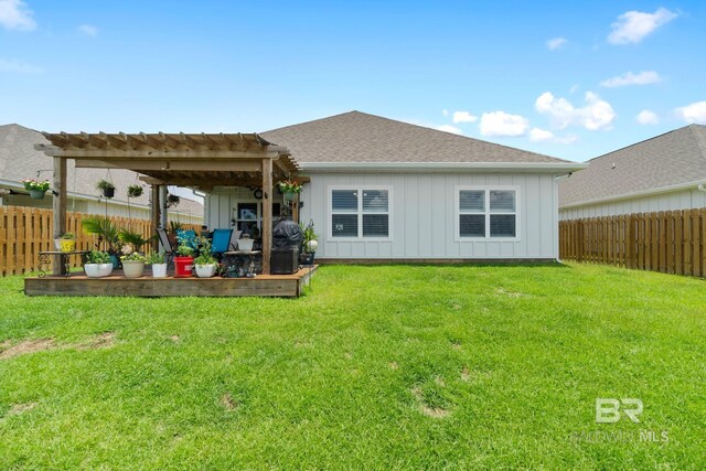 4175 Montague Dr, Gulf Shores, AL 36542 - back of house featuring board and batten siding, a fenced backyard, a deck, and a pergola