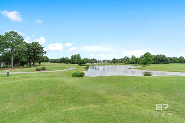 4175 Montague Dr, Gulf Shores, AL 36542 - view of home's community featuring a water view, a yard, view of golf course, and view of wooded area