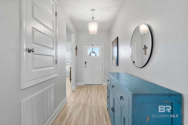 4175 Montague Dr, Gulf Shores, AL 36542 - foyer with baseboards and light wood-style flooring