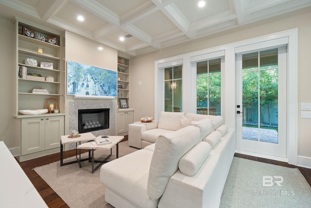 living room with crown molding, built in features, coffered ceiling, dark hardwood / wood-style flooring, and beamed ceiling