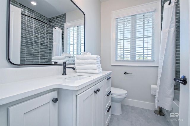 full bathroom with shower / bath combination with curtain, vanity, toilet, and tile patterned flooring