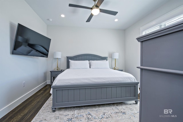 bedroom featuring ceiling fan and dark hardwood / wood-style floors