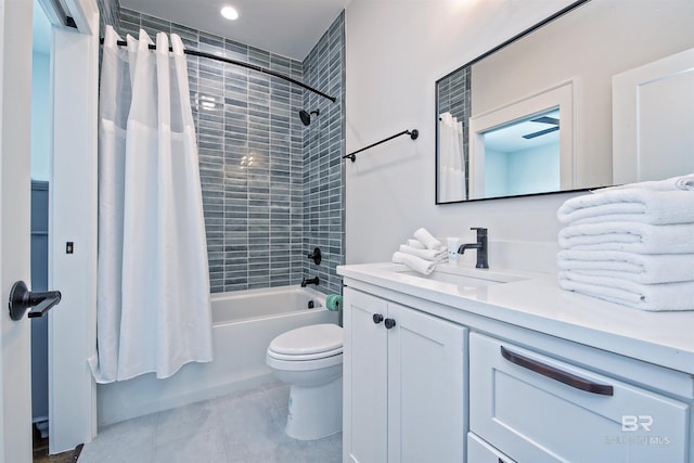 full bathroom featuring vanity, shower / bath combination with curtain, and toilet