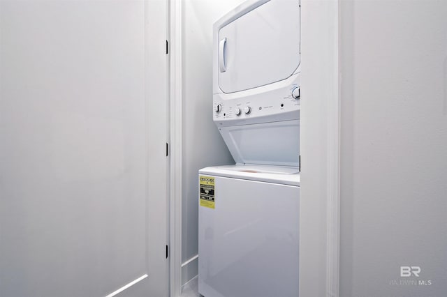 laundry area featuring stacked washer and clothes dryer