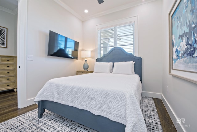 bedroom with crown molding, dark wood-type flooring, and ceiling fan