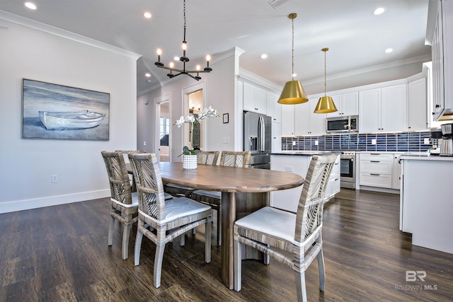 dining space featuring crown molding, dark wood-type flooring, and a chandelier