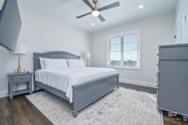 bedroom with dark wood-type flooring and ceiling fan