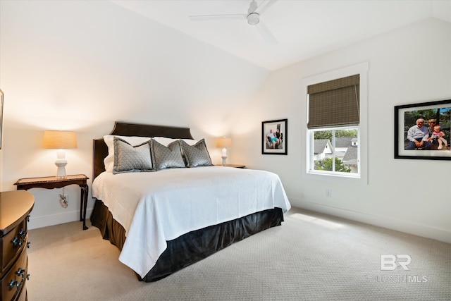 bedroom with carpet, ceiling fan, and vaulted ceiling