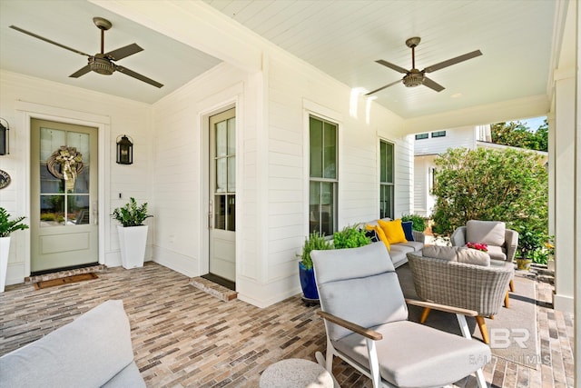 view of terrace featuring ceiling fan and an outdoor living space