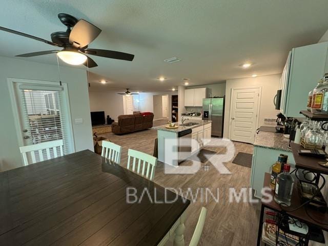 32807 N Pickens Ave, Lillian, AL 36549 - dining area featuring a ceiling fan and light wood-type flooring