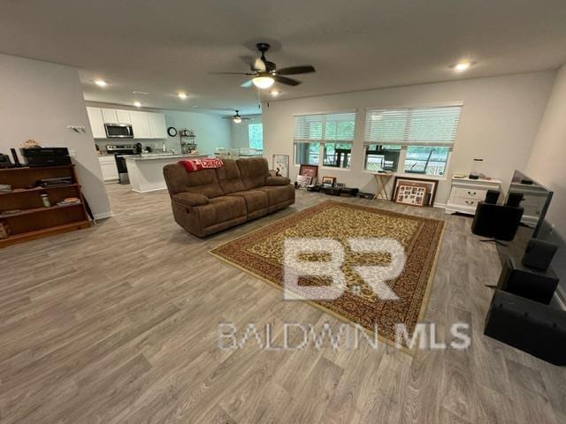 32807 N Pickens Ave, Lillian, AL 36549 - living room with a ceiling fan, light wood-style floors, and recessed lighting