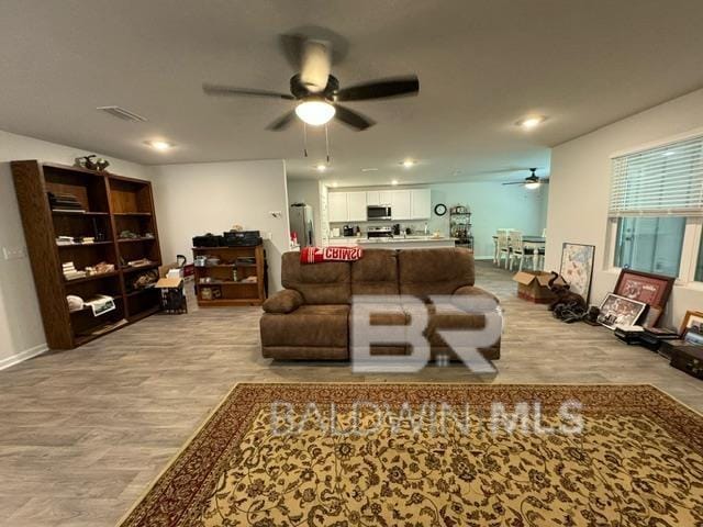 32807 N Pickens Ave, Lillian, AL 36549 - living room featuring ceiling fan, wood finished floors, and recessed lighting
