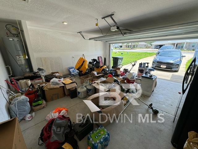 32807 N Pickens Ave, Lillian, AL 36549 - garage with water heater and a garage door opener