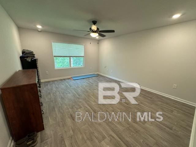32807 N Pickens Ave, Lillian, AL 36549 - empty room featuring wood finished floors, a ceiling fan, baseboards, and recessed lighting