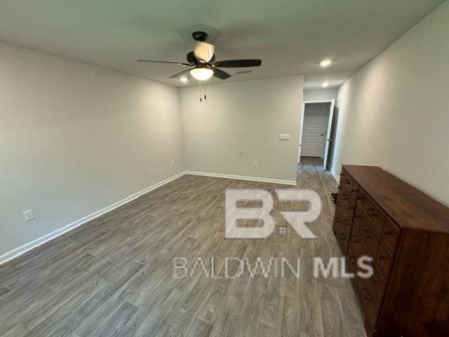 32807 N Pickens Ave, Lillian, AL 36549 - empty room with a ceiling fan, wood finished floors, and baseboards