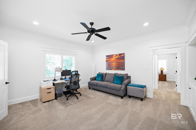 home office with light carpet, ornamental molding, and ceiling fan