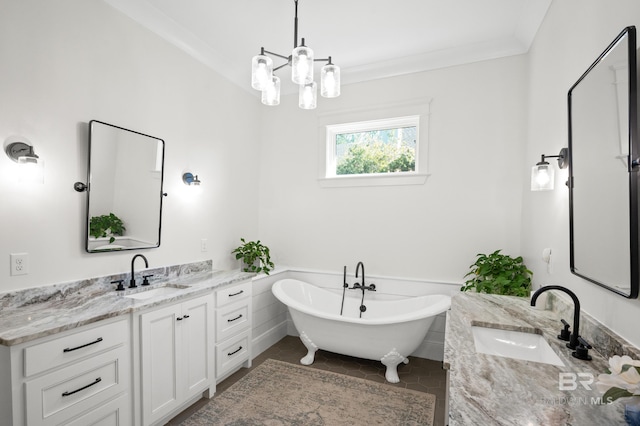 bathroom with a bathtub, an inviting chandelier, vanity, crown molding, and tile patterned flooring