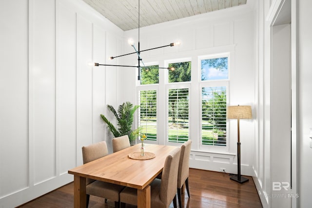 dining room with a chandelier and dark hardwood / wood-style floors