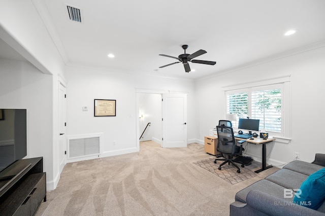 carpeted office space with ornamental molding and ceiling fan