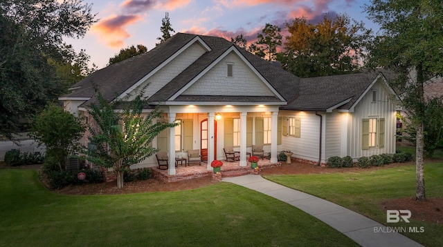 view of front facade featuring a patio area and a lawn