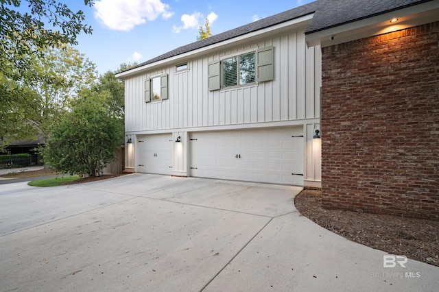 view of side of property featuring a garage