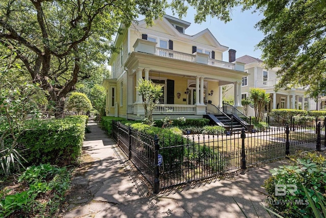 251 S Georgia Ave, Mobile, AL 36604 - victorian home featuring a porch, stairs, and a fenced front yard