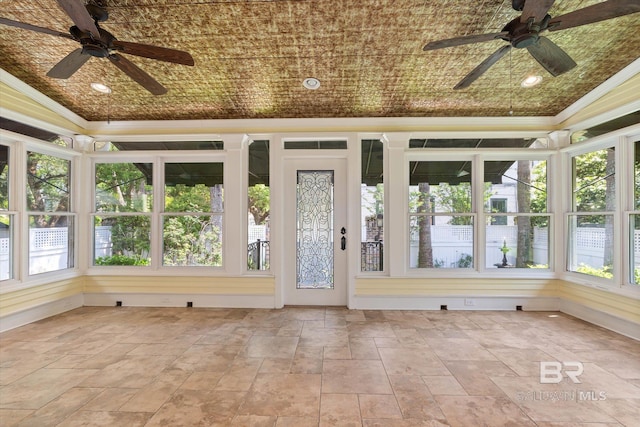 251 S Georgia Ave, Mobile, AL 36604 - unfurnished sunroom with stone finish floor, a wealth of natural light, and crown molding