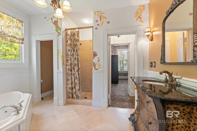 251 S Georgia Ave, Mobile, AL 36604 - bathroom featuring a tile shower, a wealth of natural light, vanity, and a tub with jets