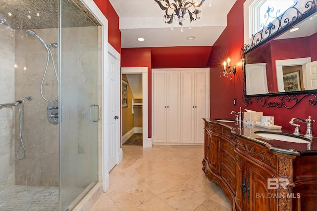251 S Georgia Ave, Mobile, AL 36604 - full bathroom with a towering ceiling, a stall shower, a notable chandelier, and a sink