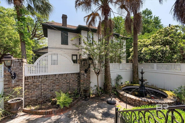 251 S Georgia Ave, Mobile, AL 36604 - back of property with a chimney and fence