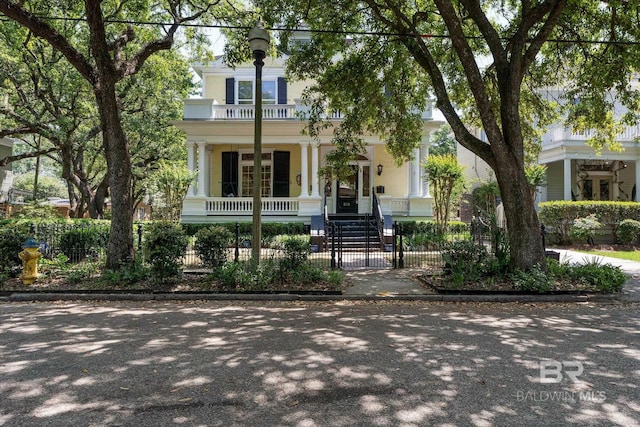 251 S Georgia Ave, Mobile, AL 36604 - view of front of property featuring a balcony, a porch, and a fenced front yard