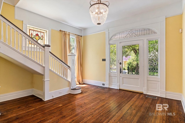 251 S Georgia Ave, Mobile, AL 36604 - entrance foyer with visible vents, baseboards, a chandelier, stairs, and hardwood / wood-style flooring