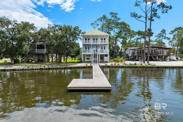 dock area with a water view and a balcony