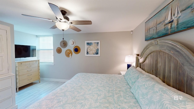 511 E Beach Blvd Unit 503, Gulf Shores, AL 36542 - bedroom featuring light wood finished floors, baseboards, and a ceiling fan