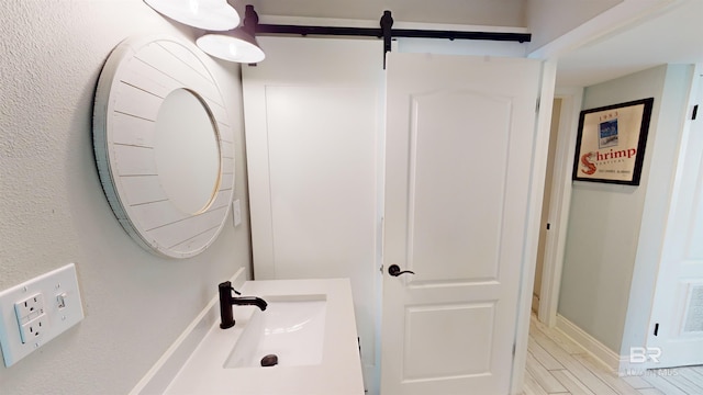 511 E Beach Blvd Unit 503, Gulf Shores, AL 36542 - bathroom featuring a sink and baseboards
