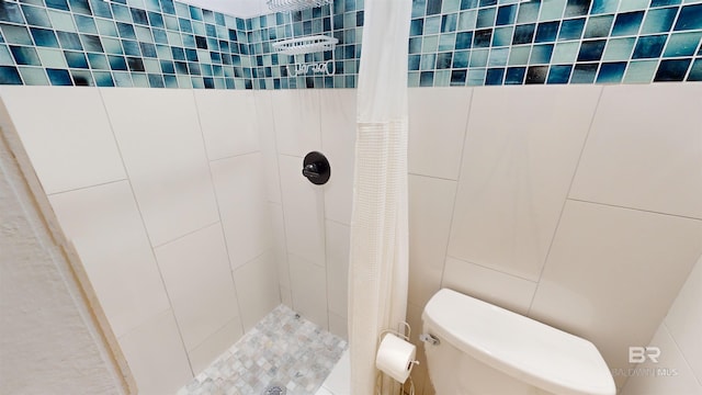 511 E Beach Blvd Unit 503, Gulf Shores, AL 36542 - bathroom with a shower stall, toilet, and tile walls