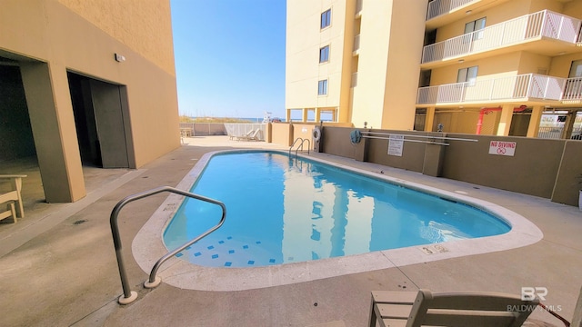 511 E Beach Blvd Unit 503, Gulf Shores, AL 36542 - community pool with a patio area and fence