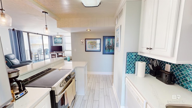 511 E Beach Blvd Unit 503, Gulf Shores, AL 36542 - kitchen with range with electric cooktop, baseboards, open floor plan, and pendant lighting