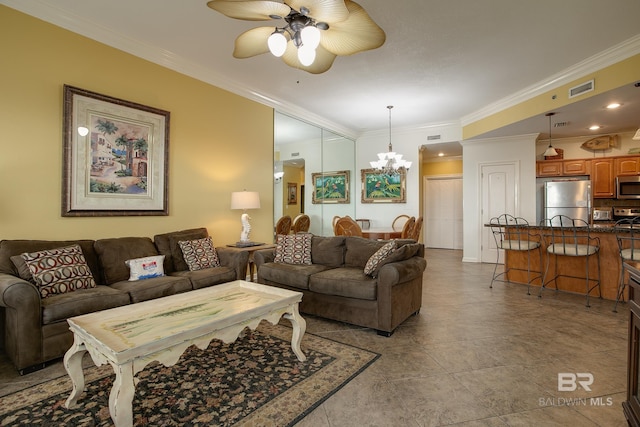 living area with visible vents, crown molding, and ceiling fan with notable chandelier