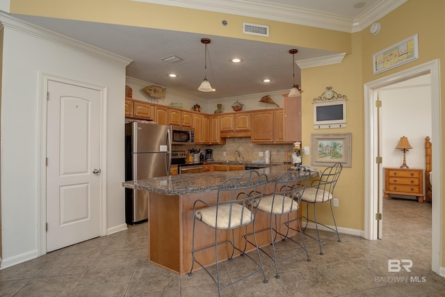 kitchen featuring visible vents, ornamental molding, backsplash, appliances with stainless steel finishes, and a peninsula