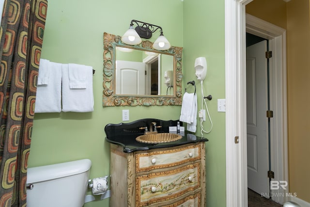 bathroom with vanity and toilet