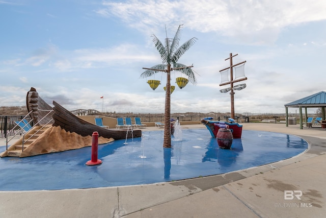 view of jungle gym with a gazebo and fence