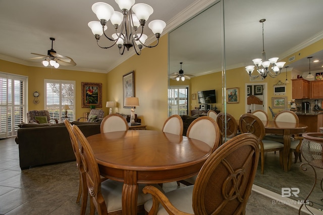 dining space with tile patterned floors, visible vents, crown molding, and ceiling fan with notable chandelier