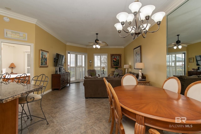 dining room featuring plenty of natural light, ceiling fan with notable chandelier, and ornamental molding