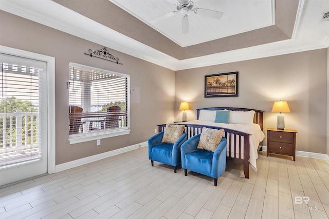 201 W 13th St Unit 2 B, Gulf Shores, AL 36542 - bedroom featuring a raised ceiling, multiple windows, baseboards, access to outside, and crown molding