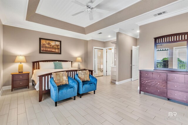 201 W 13th St Unit 2 B, Gulf Shores, AL 36542 - bedroom with baseboards, crown molding, ensuite bathroom, a tray ceiling, and ceiling fan