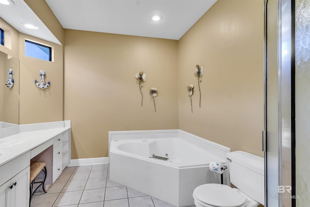 201 W 13th St Unit 2 B, Gulf Shores, AL 36542 - full bath featuring a tub with jets, vanity, toilet, tile patterned flooring, and baseboards